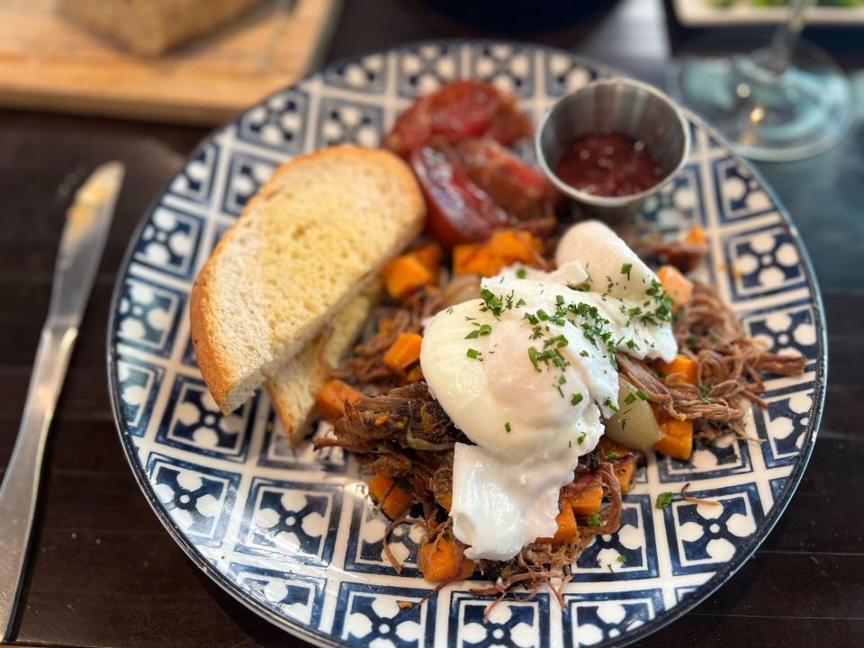 The smoked brisket hash platter at Colab Kitchen restaurant in downtown Stuart.