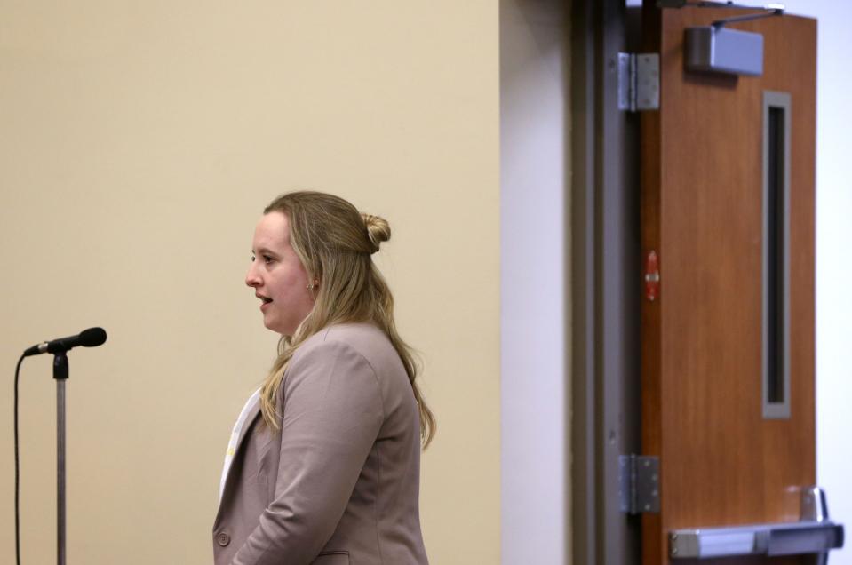 Emily Hudachek, a Hills resident and former student at the elementary school, speaks during an Iowa City Community School board meeting public comment section as a proposal to close the school following the 2023-24 school year is discussed Tuesday, March 26, 2024 in Iowa City.