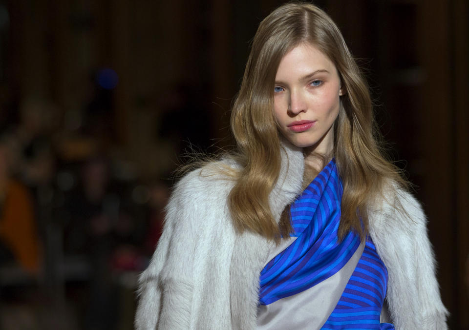 A model wears a creation by French fashion designer Christophe Lemaire for Hermes Ready to Wear's Fall-Winter 2013-2014 fashion collection, presented, Tuesday, March 5, 2013 in Paris. (AP Photo/Jacques Brinon)