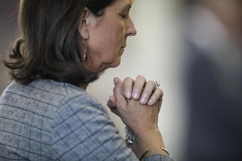 Texas State Sen. Angela Paxton, R-McKinney, wife of suspended Texas state Attorney General Ken Paxton, bows her head in prayer before as her husband's impeachment trial resumes in the Senate Chamber at the Texas Capitol on Friday, Sept. 15, 2023, in Austin, Texas. She will not be eligible to cast a vote in the her husband's impeachment trial. (Sam Owens/The San Antonio Express-News via AP, Pool)