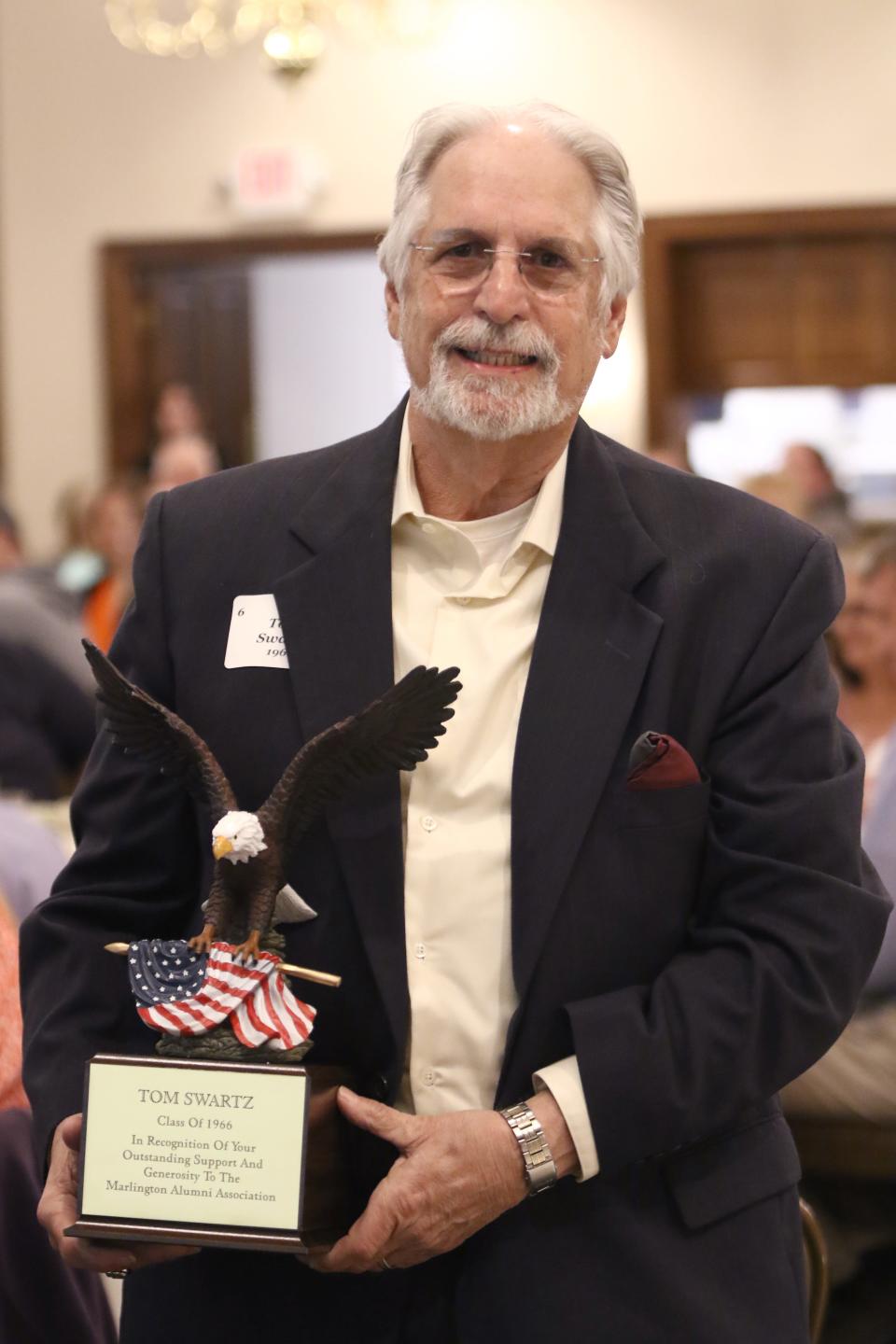 Tom Swartz, a 1966 graduate of Marlington High School, received an award at the 2023 Marlington Alumni Association banquet, honoring Swartz’s commitment to the organization and exceptional efforts in raising private support for scholarships.