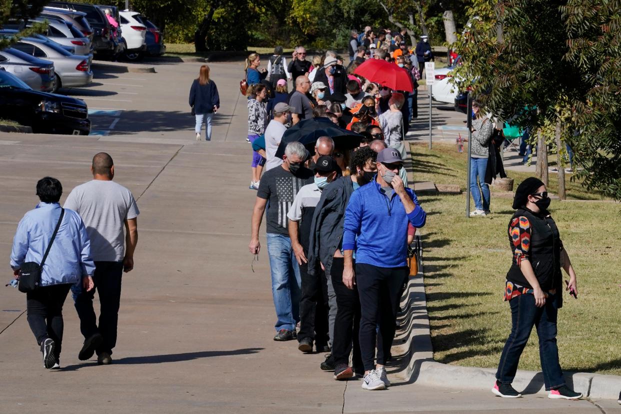 Voters queued for up to five hours to participate in early voting at a polling place in Oklahoma on 30 October. (AP)