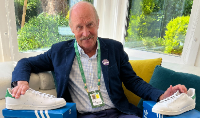 Former Wimbledon champion Stan Smith poses with his signature Addias shoes in 2022