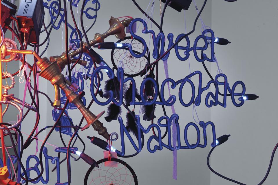 A detail of Sweet Chocolate Nation (2006) by Jason Rhoades