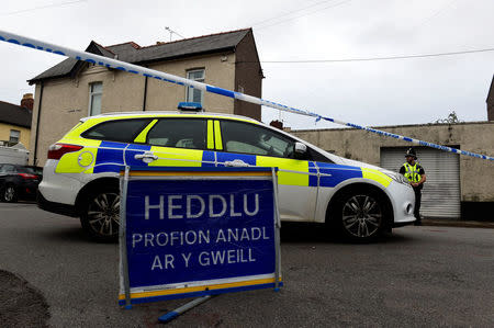 A police officer stands behind cordon tape after a man was arrested in connection with an explosion on the London Underground, in Newport, Wales, Britain, September 20, 2017. REUTERS/Rebecca Naden