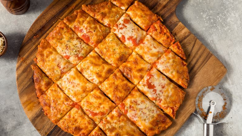 tavern-style pizza cut in grid pattern