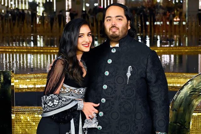 <p>Vijay Bate/Hindustan Times via Getty</p> Anant Ambani with Radhika Merchant