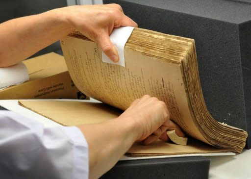 German restorer Monika Schneider-Gast works on restoring the hand-written novels, the original editions of national hero Jose Rizal's books "Noli Me Tangere" (Touch Me Not) and "El Filibusterismo" (Reign of Greed) at the National Library in Manila in May 2011. Schneider-Gast said tropical conditions and the library's threadbare budget were big obstacles to saving them for future generations