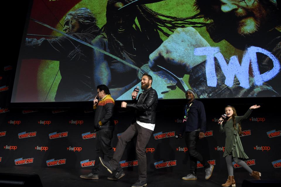 Josh McDermitt, Ross Marquand, Seth Gilliam, and Cailey Fleming are seen at 2019's New York Comic Con panel for "TWD."