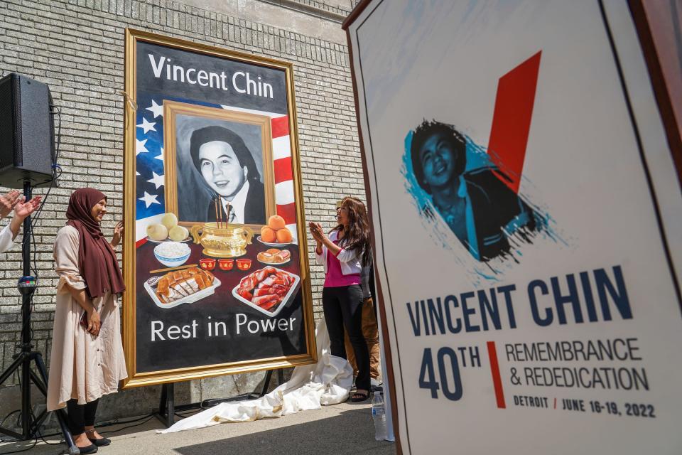 Artist Anthony Lee, of Madison Heights unveils an 11' x14' standing wall art painting in memory of Vincent Chin, during a 40th-anniversary observance of Chin's death at the corner of Cass avenue and Peterboro street in Detroit's former Chinatown on Wednesday, June 15, 2022. Chin was was beaten to death by two white men with a baseball bat in 1982. His killers received no jail time.