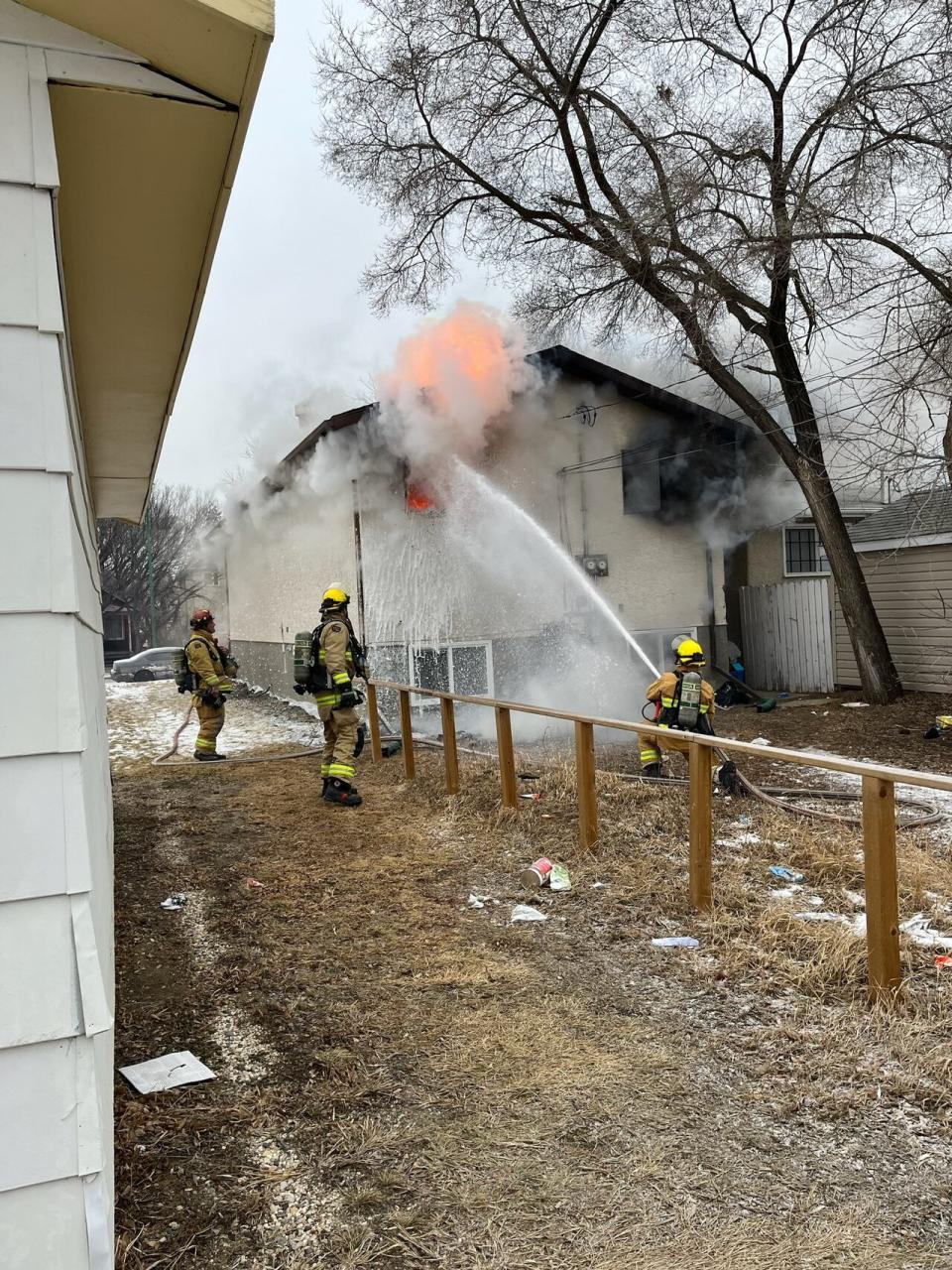 Fire crews work on a house fire on the 900 block Rae Street in Regina on Jan. 2. (Regina Fire and Protective Services. - image credit)