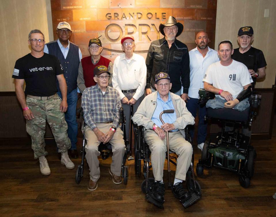 <p>Grand Ole Opry / Chris Hollo</p> Trace Adkins backstage with his invited guests. Left to right: Josh Bryant (Iraqi Freedom), James Hubbard (Vietnam), James F. Wren (WWII), Oscar Minchey (WWII), John W. Collins (Korea), Trace Adkins, Arnold "AW" Simpkins (WWII), Bryan Gerwitz (Iraqi Freedom), Bryan Anderson (Iraqi Freedom), Ben Fouts (Vietnam)