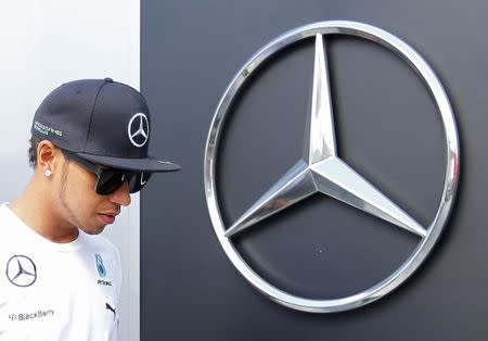 Mercedes Formula One driver Lewis Hamilton of Britain walks in at the Hungaroring circuit, near Budapest, July 24, 2014. REUTERS/Laszlo Balogh