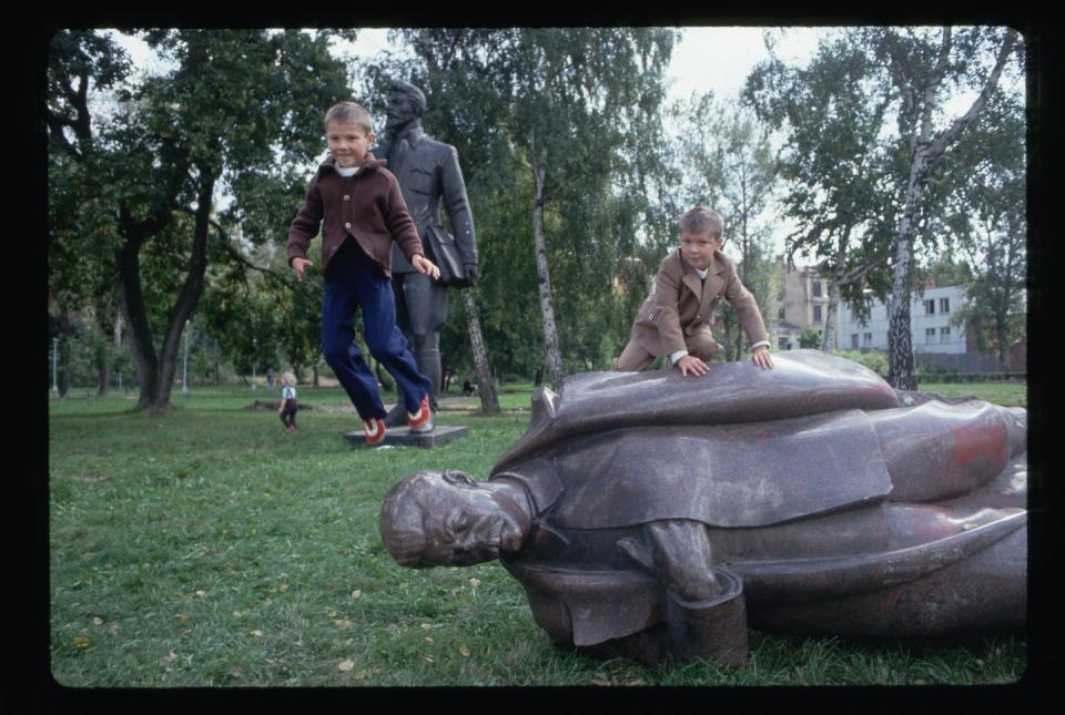 Russian children play atop a toppled statue of the Soviet dictator Joseph Stalin, after the fall of the Soviet Union in 1991. <a href="https://www.gettyimages.com/detail/news-photo/after-the-coup-children-play-on-a-toppled-statue-of-stalin-news-photo/635966617?adppopup=true" rel="nofollow noopener" target="_blank" data-ylk="slk:Peter Turnley/Corbis/VCG via Getty Images;elm:context_link;itc:0;sec:content-canvas" class="link ">Peter Turnley/Corbis/VCG via Getty Images</a>