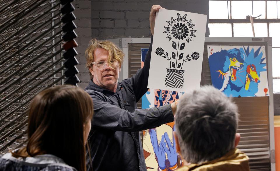 Rick Sinnett shows a screenprint April 22, 2023, during the sixth annual Steamroller Print Festival at Artspace at Untitled, in Oklahoma City.