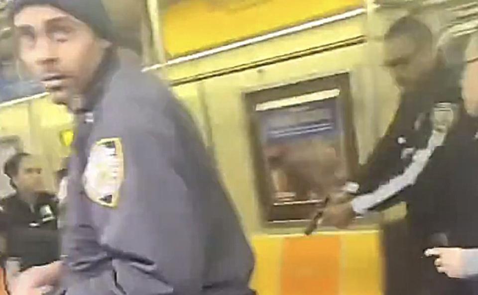 Police rush onto the train to accost the gunman