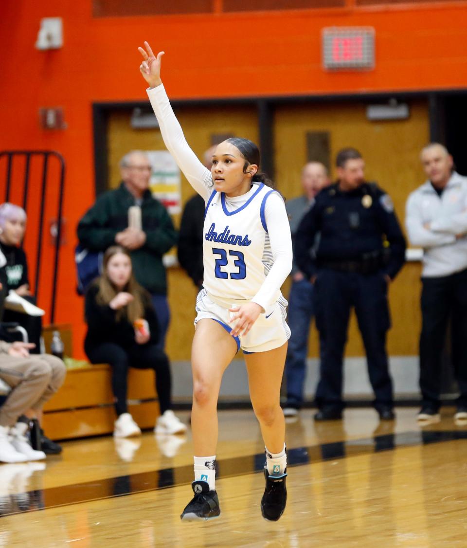 Lake Central junior Vanessa Wimberly celebrates making a '3' during a Class 4A girls basketball regional championship game against Washington Saturday, Feb. 10, 2024, at LaPorte High School.