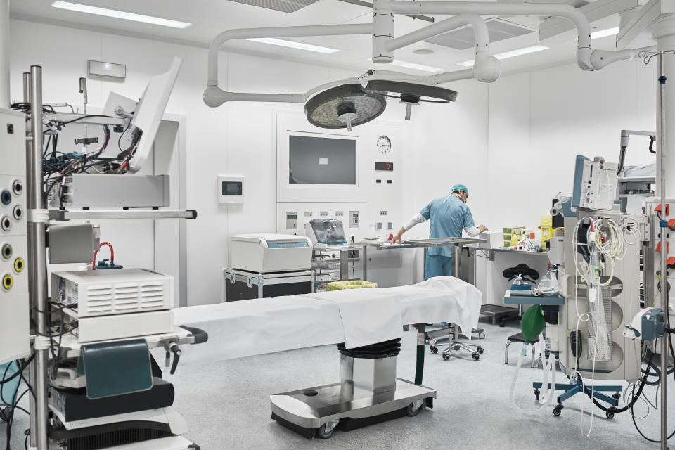 Medical professional in an operating room with medical equipment