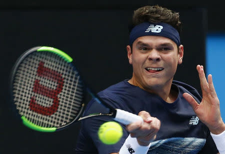 Tennis - Australian Open - Melbourne Park, Melbourne, Australia - 23/1/17 Canada's Milos Raonic hits a shot during his Men's singles fourth round match against Spain's Roberto Bautista Agut. REUTERS/Edgar Su