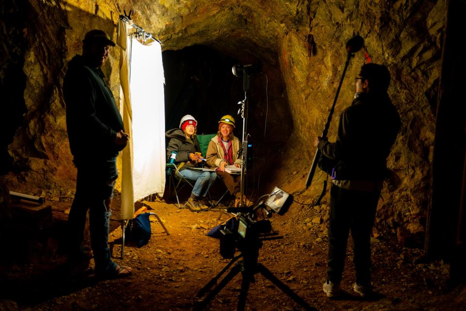 Izzie Caplan and Peggy O'Sullivan sit in the mine during filming for "All Men Are Wicked."