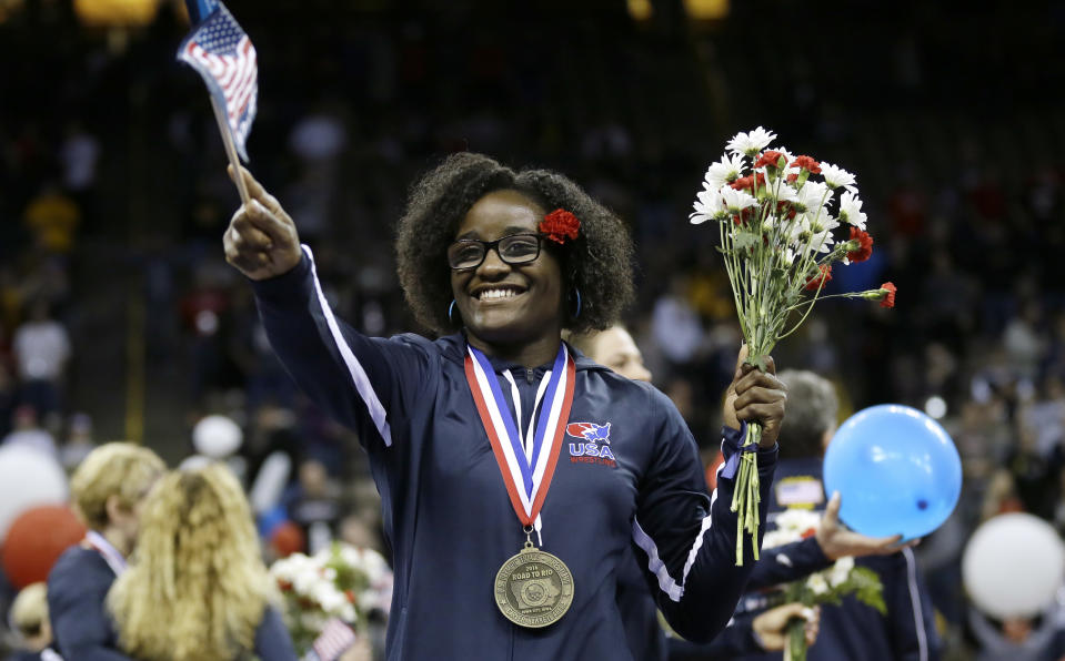 FILE - U.S. Olympic women's wrestling team member Tamyra Mensah, who now goes by Mensah-Stock, celebrates with fans during the U.S. Olympic Wrestling Team Trials, April 10, 2016, in Iowa City, Iowa. Kennedy Blades looks to become the second Black woman to win gold this summer in Paris, following Mensah-Stock’s win in Tokyo in 2021. (AP Photo/Charlie Neibergall, File)