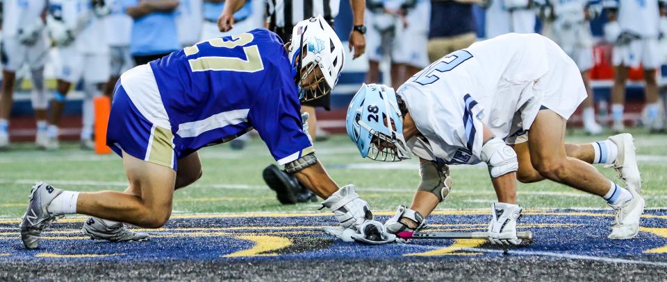 Norwell's John Mullen battled Medfield's TJ Casey during the Division 3 state title game on the campus of Worcester State University on Wednesday, June 22, 2022.