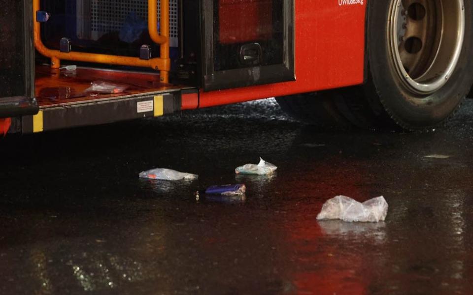 Litter strewn at the door of the bus - UK News In Pictures