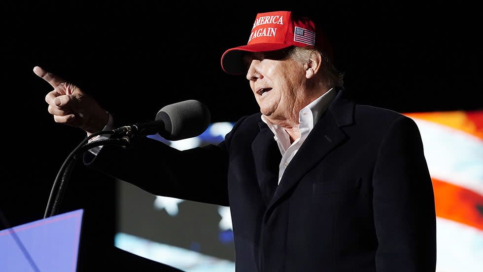 Former President Donald Trump gestures at a rally