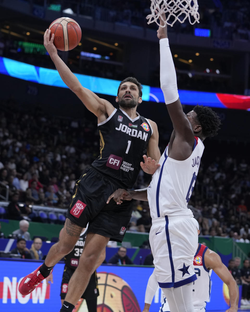 Jordan guard Amin Abu Hawwas (1) shoots over U.S. forward Jaren Jackson Jr. (13) during the first half of a Basketball World Cup group C match in Manila, Philippines Wednesday, Aug. 30, 2023. (AP Photo/Michael Conroy)