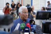Portuguese Prime Minister and Socialist Party leader Antonio Costa talks to journalists outside a polling station after voting in Lisbon Sunday, Oct. 6, 2019. Portugal is holding a general election Sunday in which voters will choose members of the next Portuguese parliament. (AP Photo/Armando Franca)
