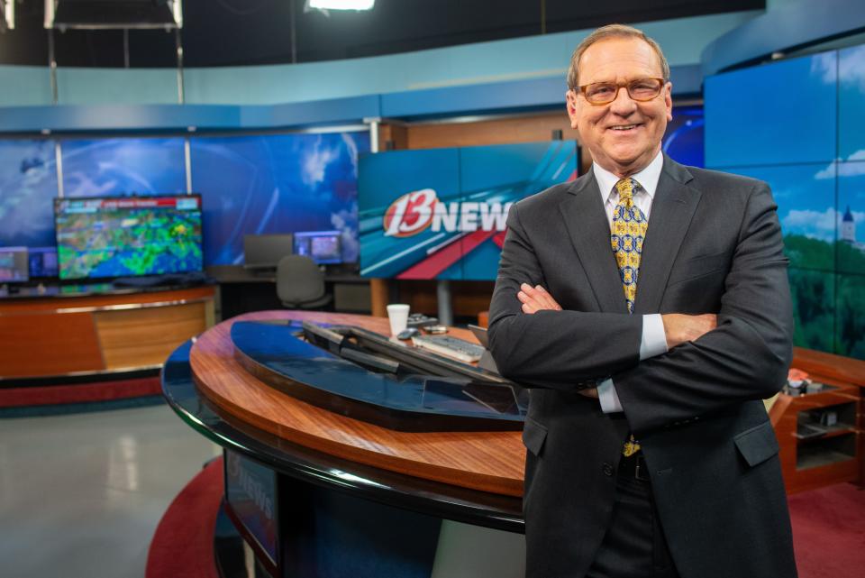 Longtime anchor Ralph Hipp leans against his desk in WIBW-TV Channel 13's studio after wrapping up the 4 p.m. newscast Wednesday. Hipp has been a news anchor for the station since 1990, except for two years.