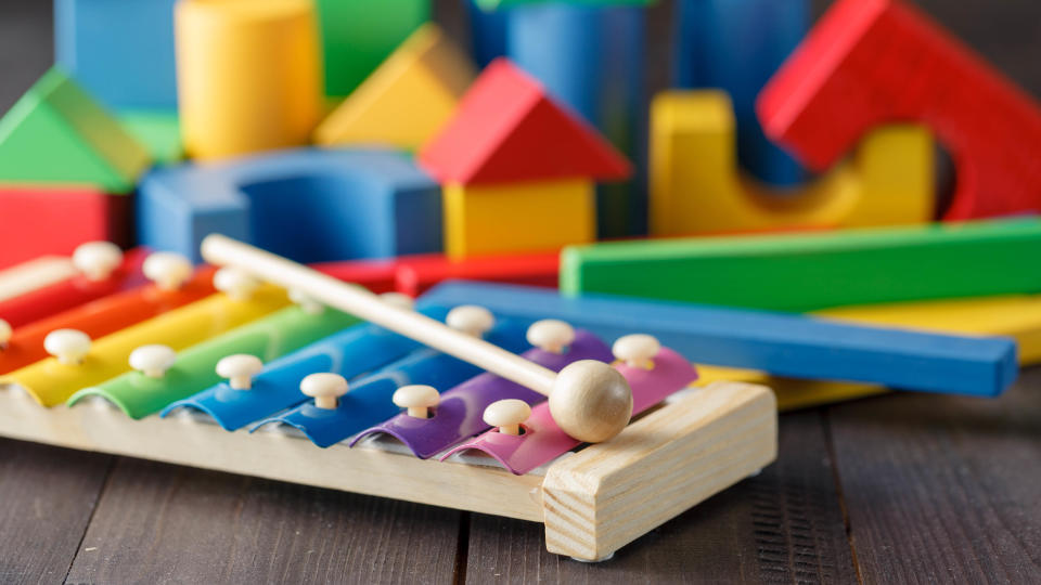 A selection of children's toys including a xylophone and building bricks