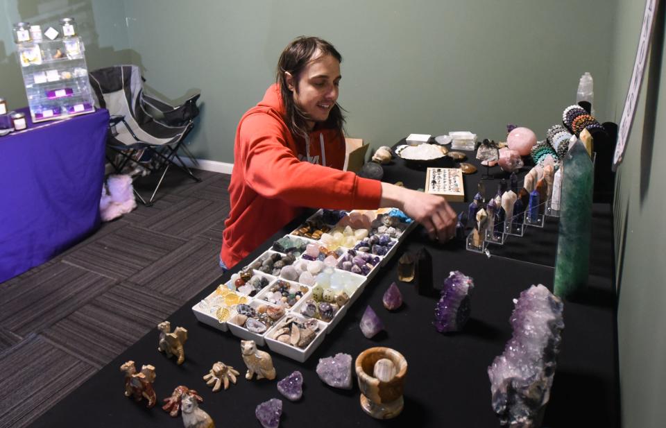 Riley Gibbs of Mainstreet Rocks in Durand sets up his pop-up shop at Better Than Ur's Designs in Delta Township. The boutique offers their own custom goods, and hosts weekend pop-up shops with other local vendors.