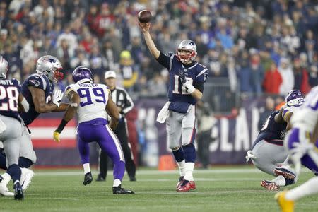 Dec 2, 2018; Foxborough, MA, USA; New England Patriots quarterback Tom Brady (12) makes a pass during the third quarter against the Minnesota Vikings at Gillette Stadium. Mandatory Credit: Greg M. Cooper-USA TODAY Sports