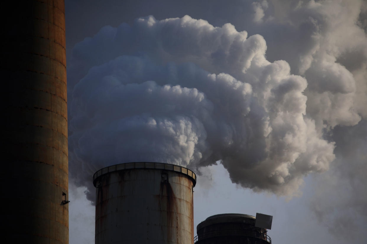 Emissions rise from the Kentucky Utilities Co. Ghent generating station in Ghent, Kentucky