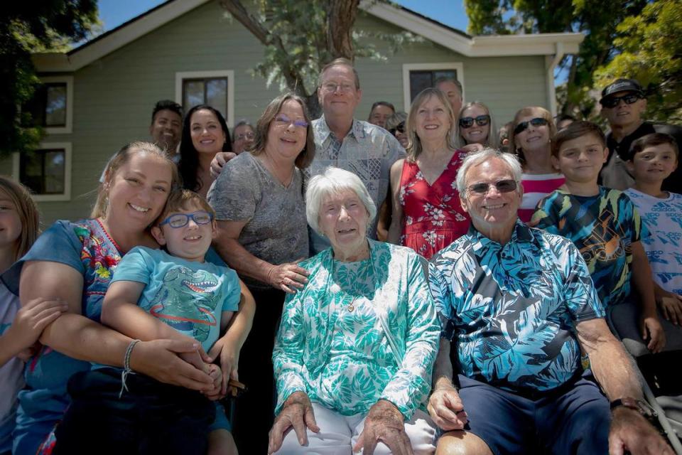 U.S. Marine Corps veteran Sgt. Elizabeth Ross, center in blue shirt, sits with her family during a July 2, 2022, birthday celebration hosted by Welcome Home Military Heroes at her daughter’s San Luis Obispo home. Ross turns 100 on July 5.