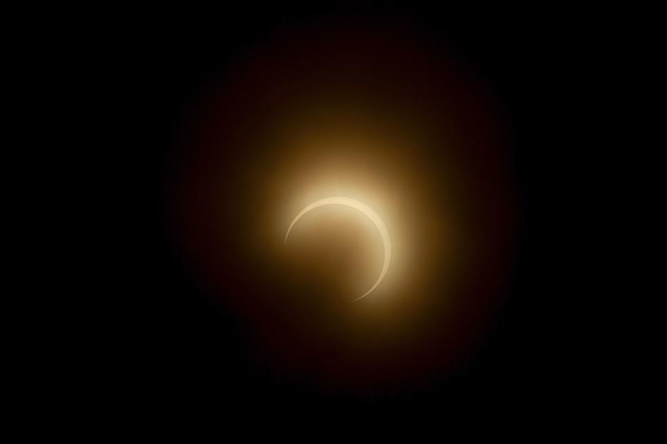 The moon crosses in front of the sun during the annular solar eclipse as smoke haze from fires in the Amazon rainforest blankets the sky in Manaus, Amazonas State, northern Brazil, on October 14, 2023. Skygazers across the Americas turned their faces upwards Saturday for a rare celestial event: an annular solar eclipse. (Photo by Michael DANTAS / AFP) (Photo by MICHAEL DANTAS/AFP via Getty Images)