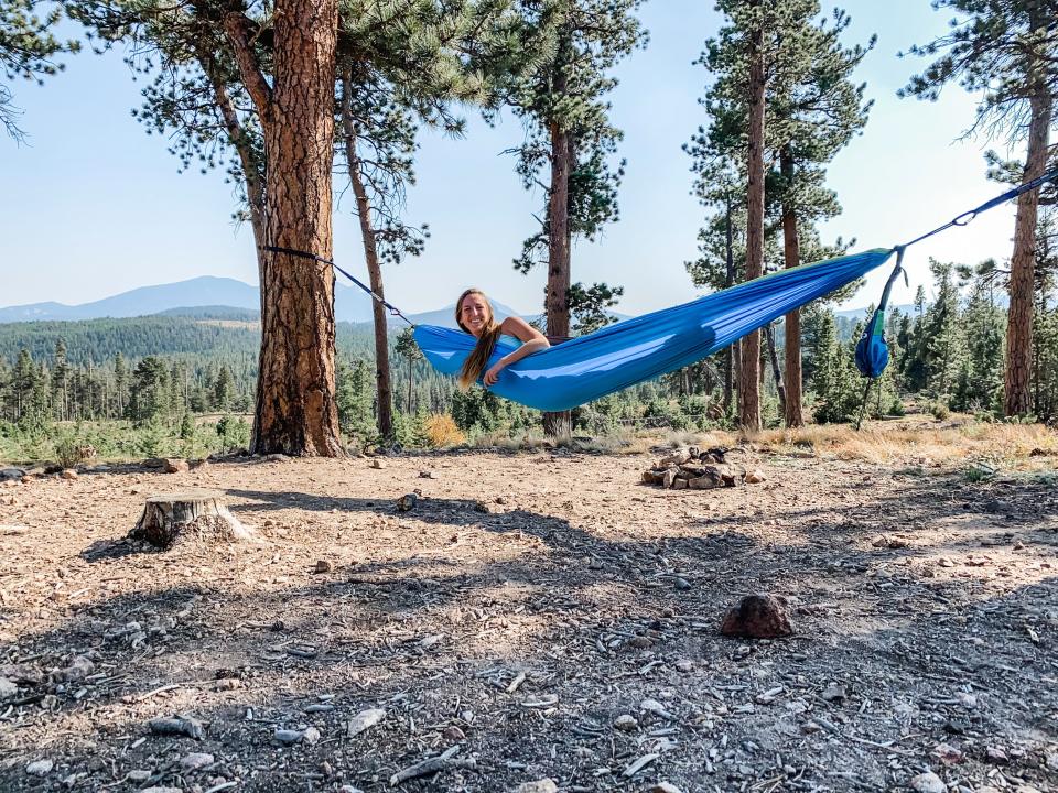 The writer hanging out in a hammock outside