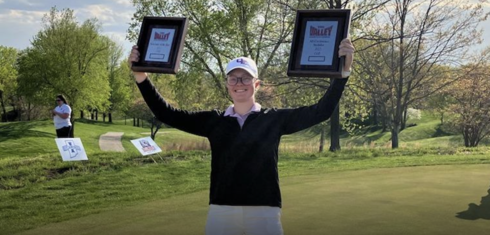 UE golfer Kate Petrova celebrates her individual MVC title and Newcomer of the Year award.