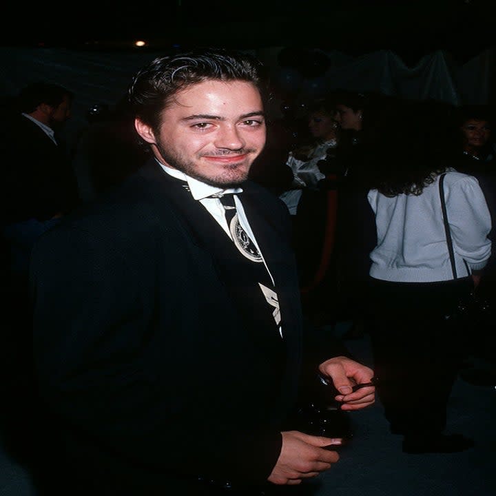 Close-up of Robert wearing a suit and tie