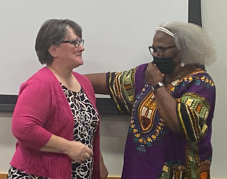 Theresa Danberry, left, was congratulated on her retirement by ISD board president Elizabeth O’Dell and others at a meeting of the board this week.