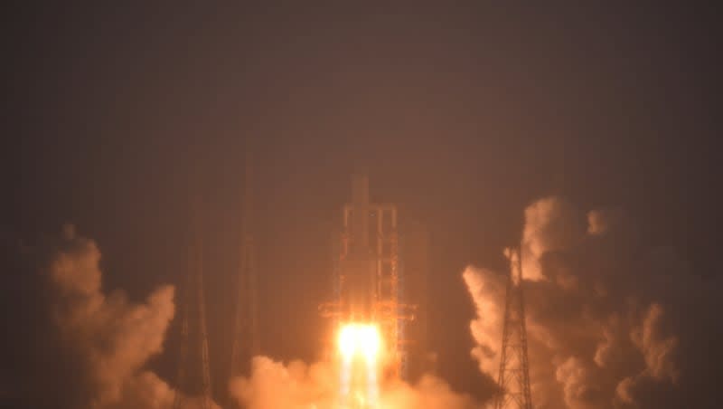 In this photo provided by China's Xinhua News Agency, a Long March-5 rocket, carrying the Chang'e-6 spacecraft, blasts off from its launchpad at the Wenchang Space Launch Site in Wenchang, south China's Hainan Province, Friday, May 3, 2024. China on Friday launched a lunar probe to land on the far side of the moon and return with samples that could provide insights into differences between the less-explored region and the better-known near side.