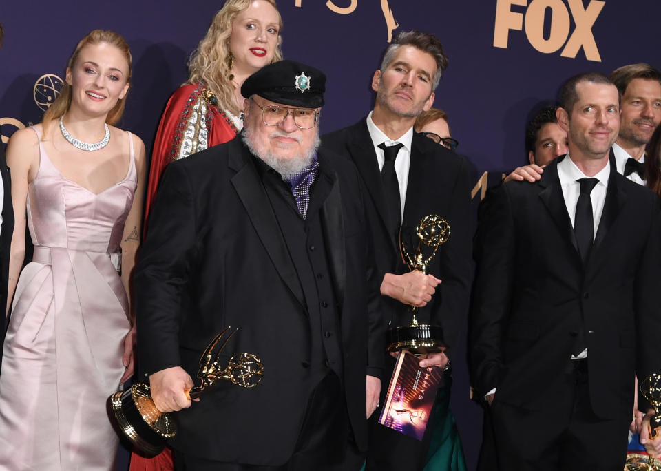 (l-R) Actors Sophie Turner, Gwendoline Christie, author George R.R. Martin, producers David Benioff and D.B. Weiss pose with the Emmy for Outstanding Drama Series 