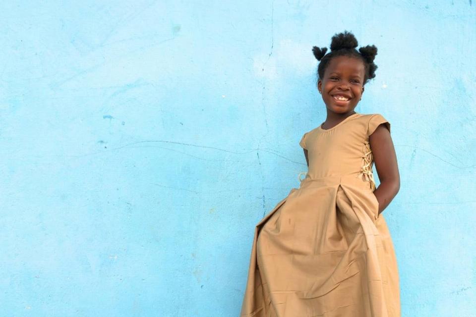 Esmerelda, a student in the SHE program, is all smiles wearing her school uniform provided by the Style Her Empowered nonprofit, which also provides tuition, school supplies, tutoring and menstrual products for 1,500 girls in Togo, Africa.