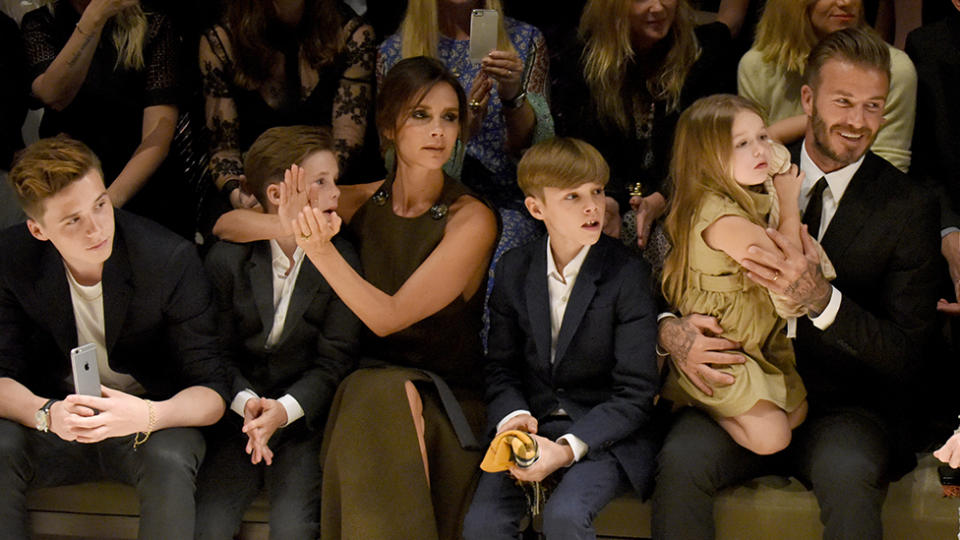 The Beckham family at a Burberry fashion show. Photo: Getty Images