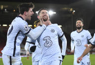 Chelsea's Jorginho, centre, celebrates after scoring the 2-1 lead from the penalty spot during the English Premier League soccer match between Sheffield United and Chelsea at Bramall Lane stadium in Sheffield, England, Sunday, Feb. 7, 2021. (Oli Scarff/ Pool via AP)