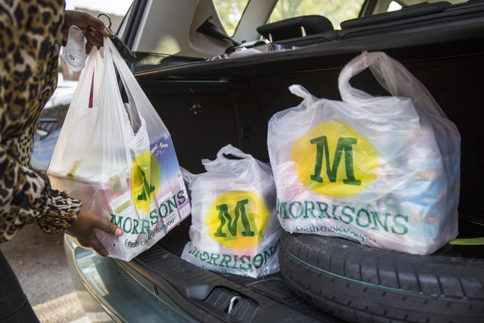 A Morrisons customer loads up their car with shopping bags (Rob Stothard/Getty Images)