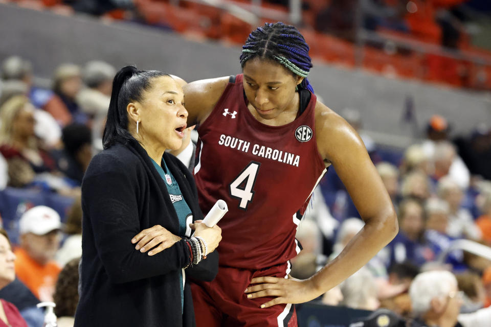 South Carolina head coach Dawn Staley, left, talks with forward Aliyah Boston (4) during the second half of an NCAA college basketball game against Auburn, Thursday, Feb. 9, 2023, in Auburn, Ala. (AP Photo/Butch Dill)