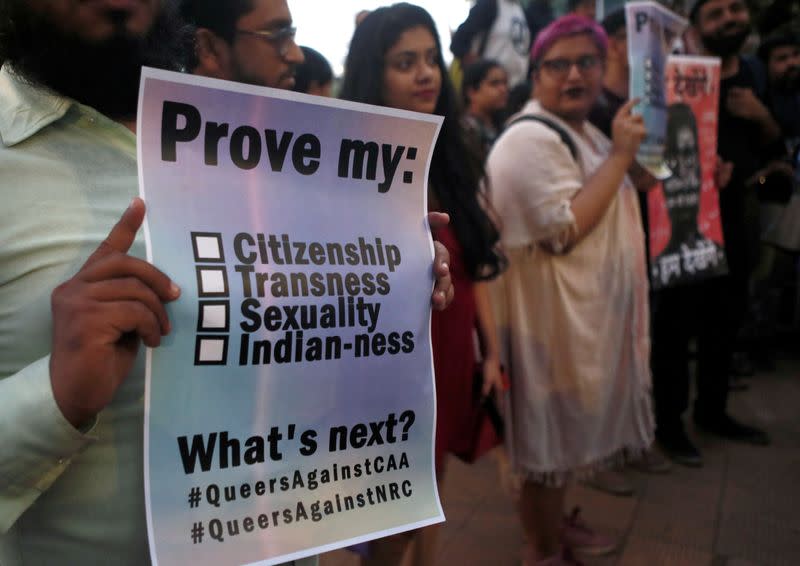 Demonstrators hold placards during a protest against a new citizenship law, in Mumbai