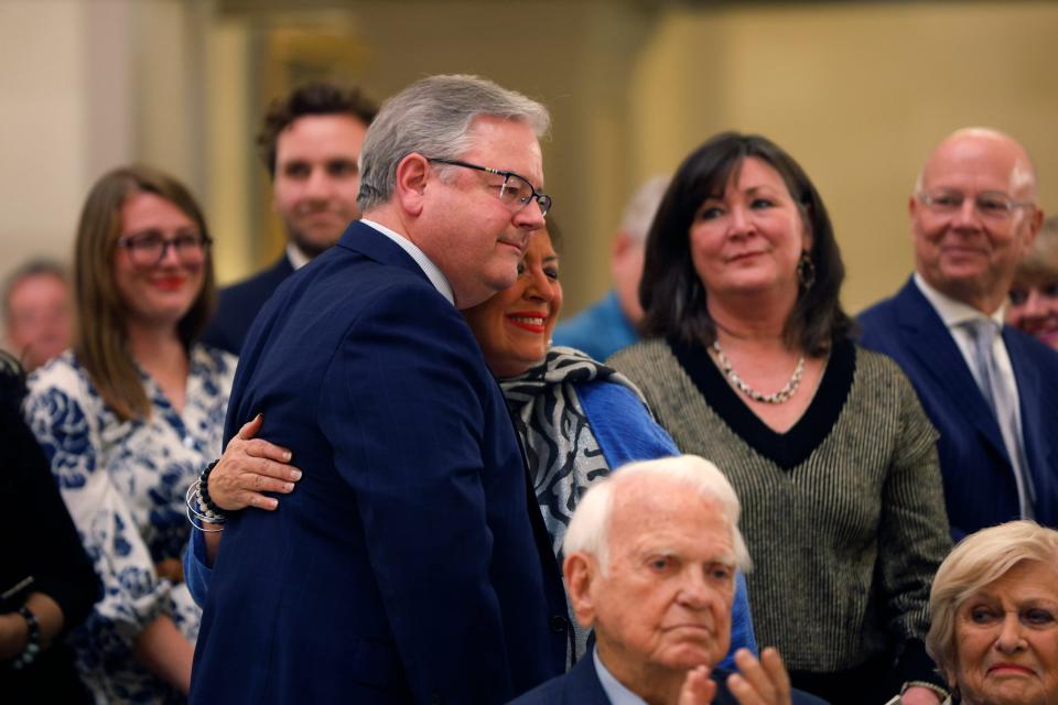 George Price and Lisa Price embrace Tuesday, Jan. 30, 2024, during a tribute to their mother, Betty Price, during the 45th Annual Governor's Arts Awards at the state Capitol in Oklahoma City.